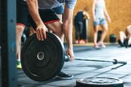 Lifting weights (Image via Pexels/Victor Frietas)